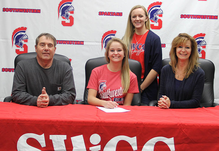Pictured in photo (L to R): Sitting - Rick Carter, Ashton’s father; Ashton Carter; and Michelle Mostek, Ashton’s mother. Standing-Kaeleigh Ballentine, SWCC head dance team coach