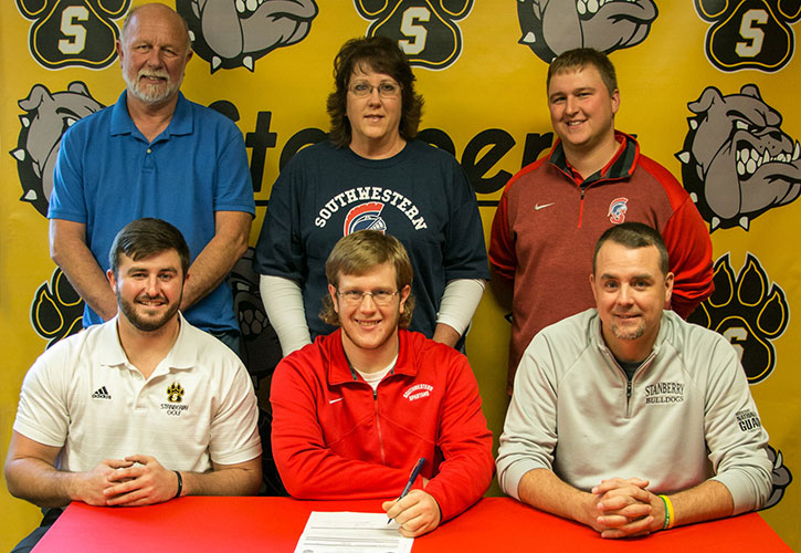 PICTURED (L to R):  Front row – Spencer Osborn, Stanberry R-II High School assistant golf coach; Mitch Carroll; and Chris McMillen, Stanberry R-II High School head golf coach. Back row – Bryan Carroll, Mitch’s father; Ronda Carroll, Mitch’s mother; and Doug North, SWCC head golf coach.