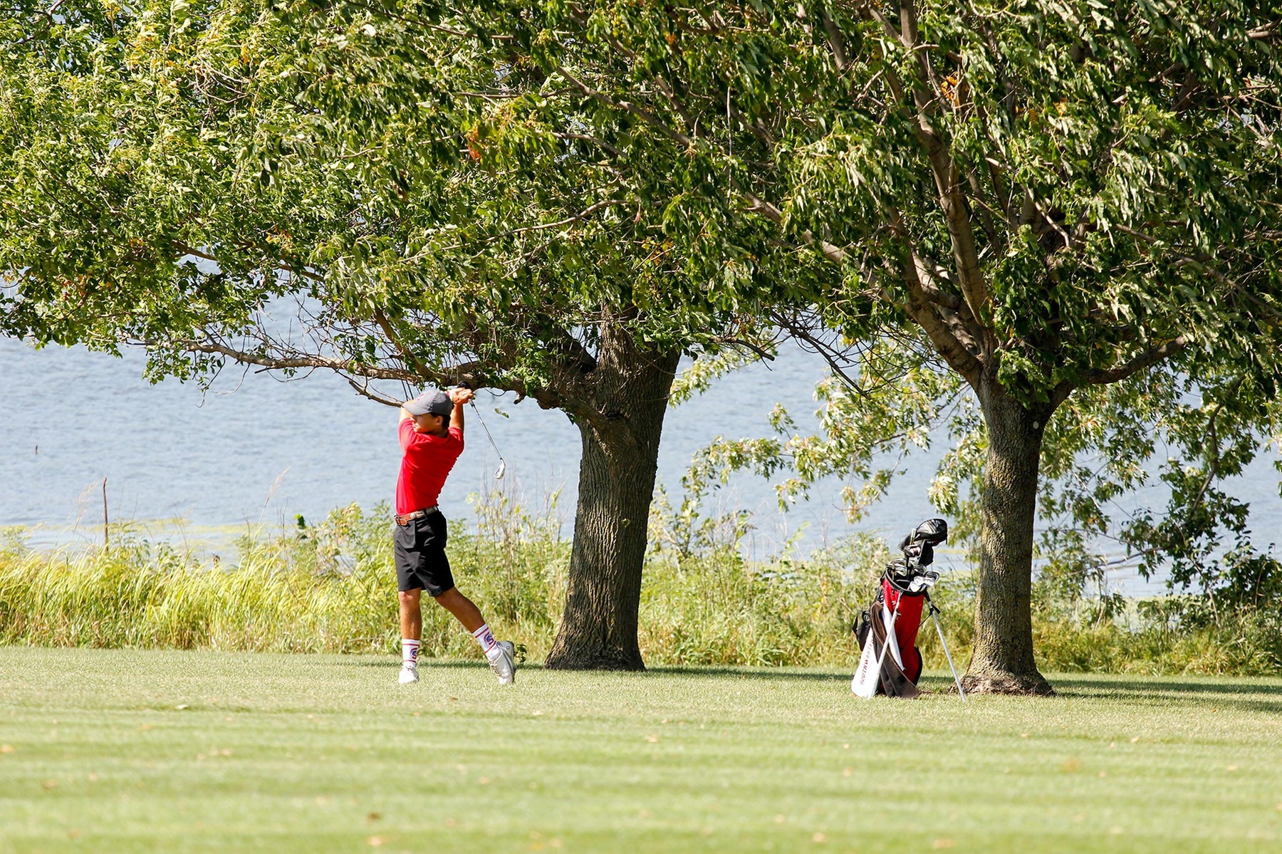 Reinhardt Saunderson hitting his second shot on hole eight at the Crestmoor Golf Club