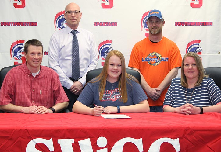 Pictured: Sitting (L to R) – Andy Tibbs, Kelsey’s father; Kelsey Tibbs; and Amy Tibbs, Kelsey’s mother. Standing – Bill Taylor, Southwestern vice president of instruction, and Andy Major, head coach for Lights Out Fast Pitch.