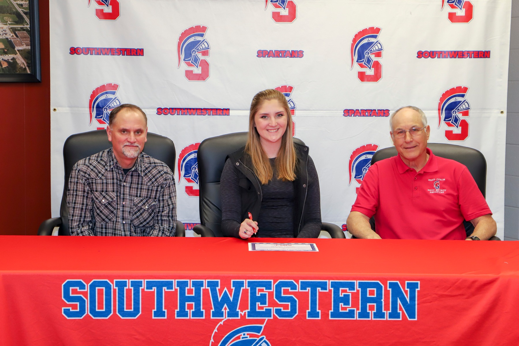 Mariah Murphy signs her letter of intent to join the Southwestern sports shooting team for the 2019-20 season.