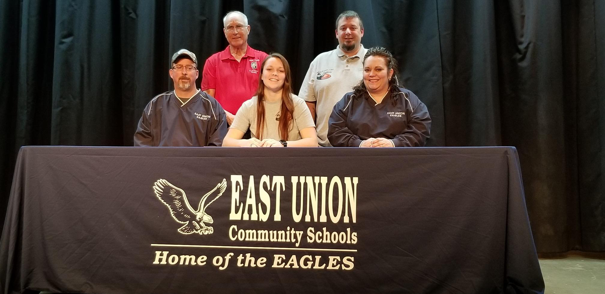 In front - Shawn Miller, Taylor's father; Taylor Miller; and Rosie Miller, Taylor's mother. In back - Marc Roberg, SWCC sports shooting coach; and Josh Purdy, East Union trap coach.