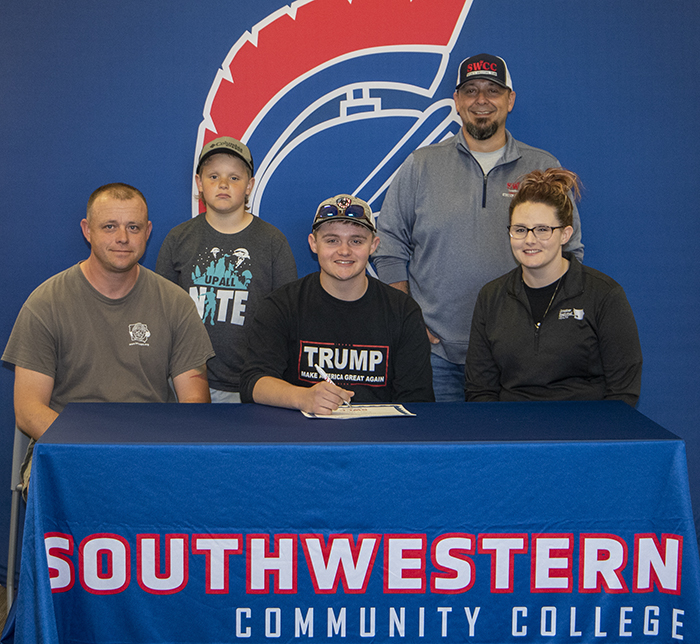 Sitting: Jeff Werner, Logan's father; Logan Werner; and Kim Werner, Logan's mother.
Standing: Drake Werner, Logan's brother, and Josh Purdy, Southwestern head sports shooting coach.