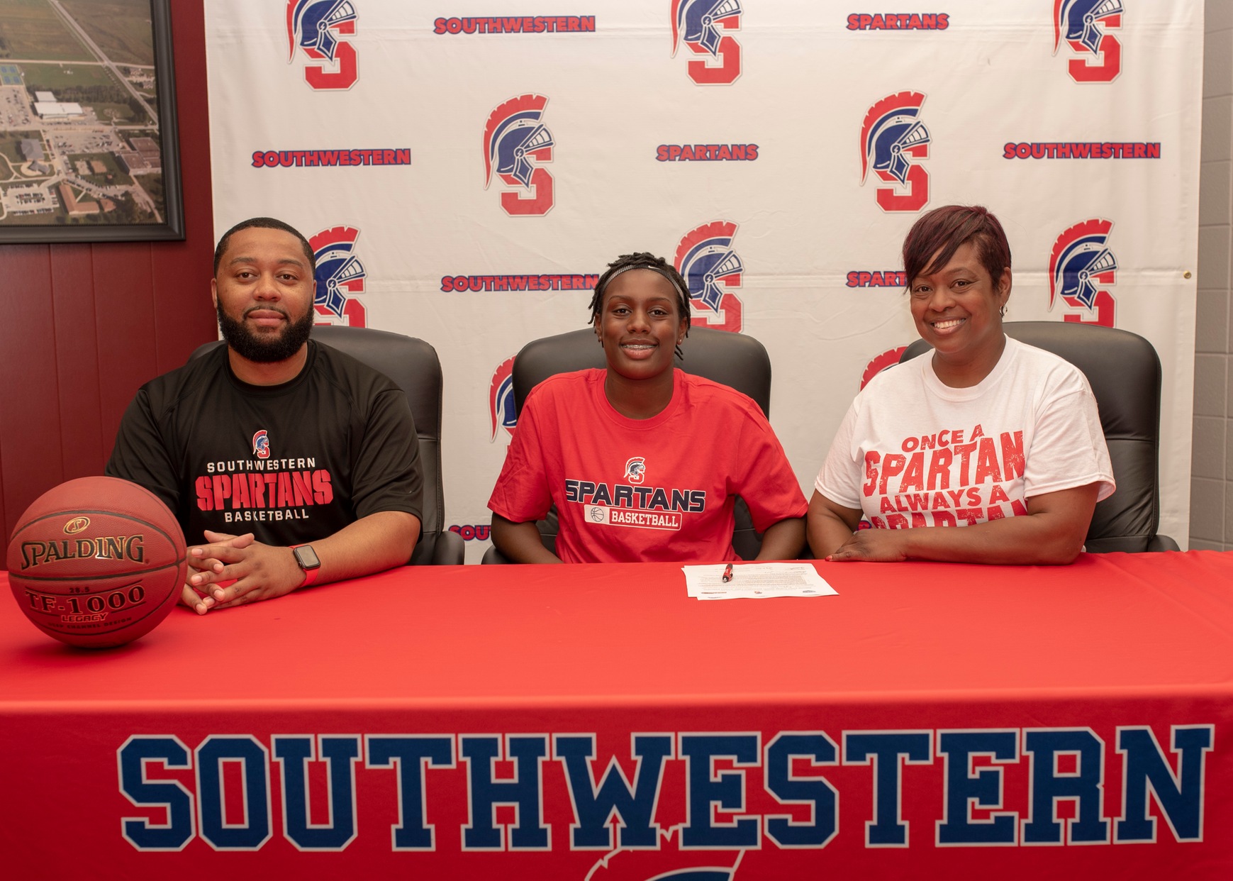 Kaylynn Tucker of Omaha signs her National Letter of Intent to join the Southwestern women's basketball team in 2019-20.