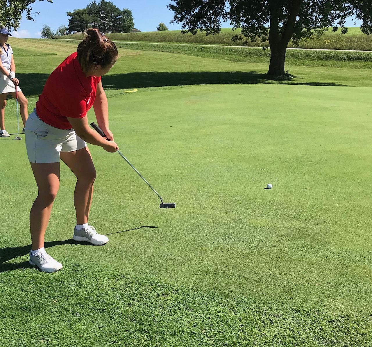 Sarah Rauschenberg, freshman from Dallas Center, IA, stares down a birdie putt at the Graceland Women's Fall Invitational.