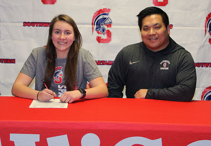 Pictured (L to R): Danica Sunderman and Casey Quiggle, Southwestern head volleyball coach