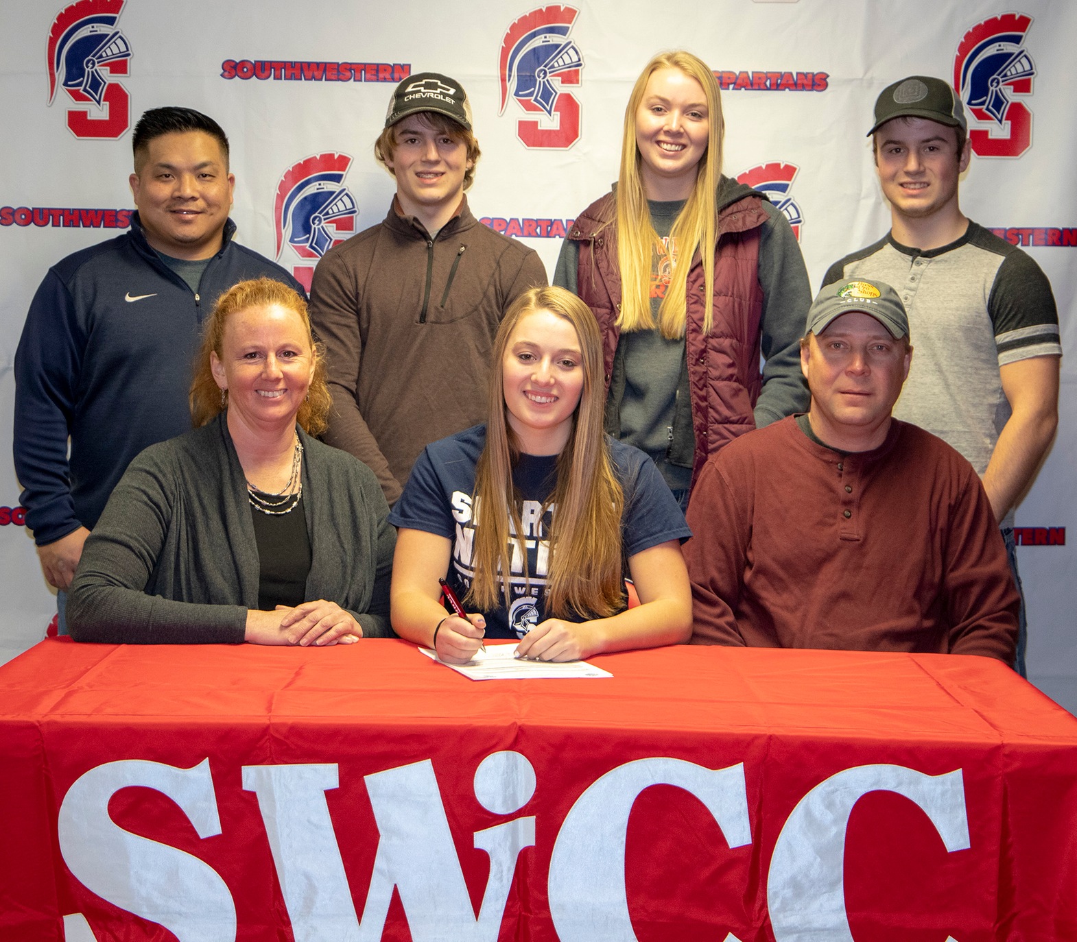 Zoie Lecy and her family at signing.