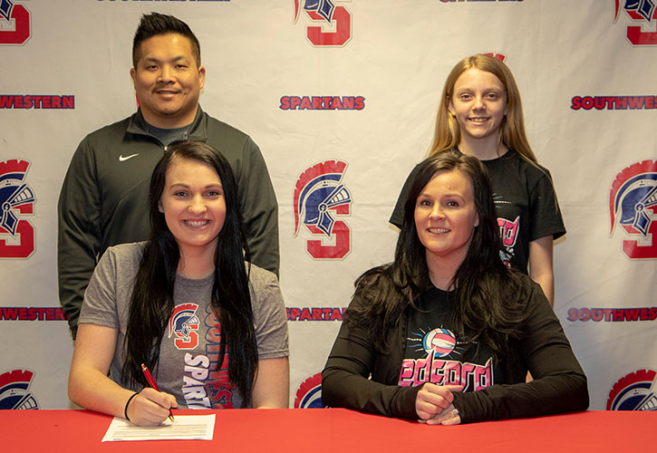 In Photo (L to R): Sitting – Paige Oldenkamp and Sarah Kernen, Paige’s mother. Standing – Casey Quiggle, Southwestern head volleyball coach, and McKenna Harmon, Paige’s sister.
